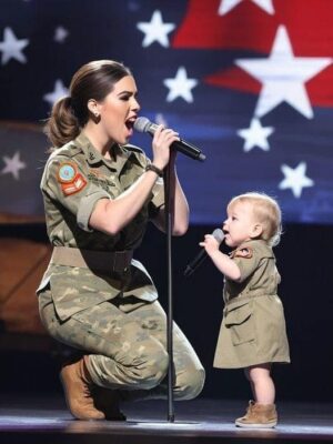 THIS COUPLE PERFORMS THE MOST FAMOUS 90S HIT. THE AUDIENCE STANDS AND APPLAUDS