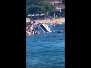 Terrifying moment ferry sinks